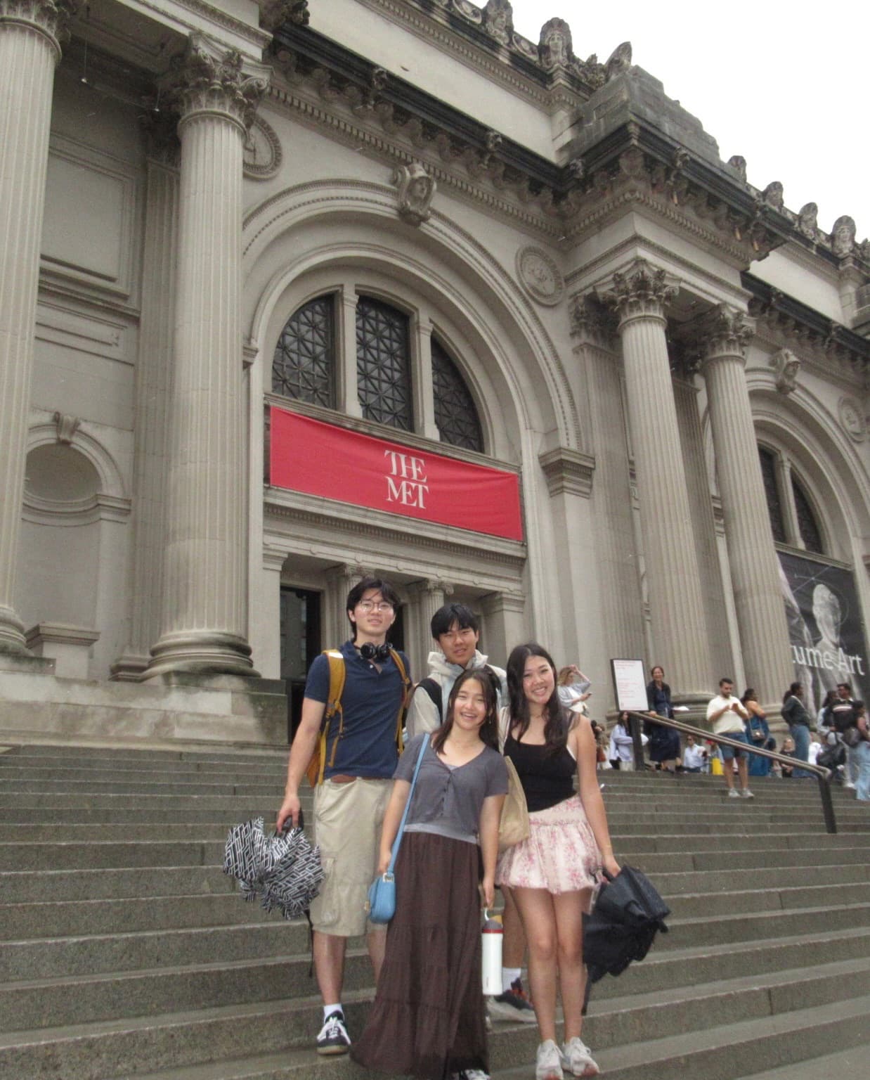 Standing with friends on the steps of the Met