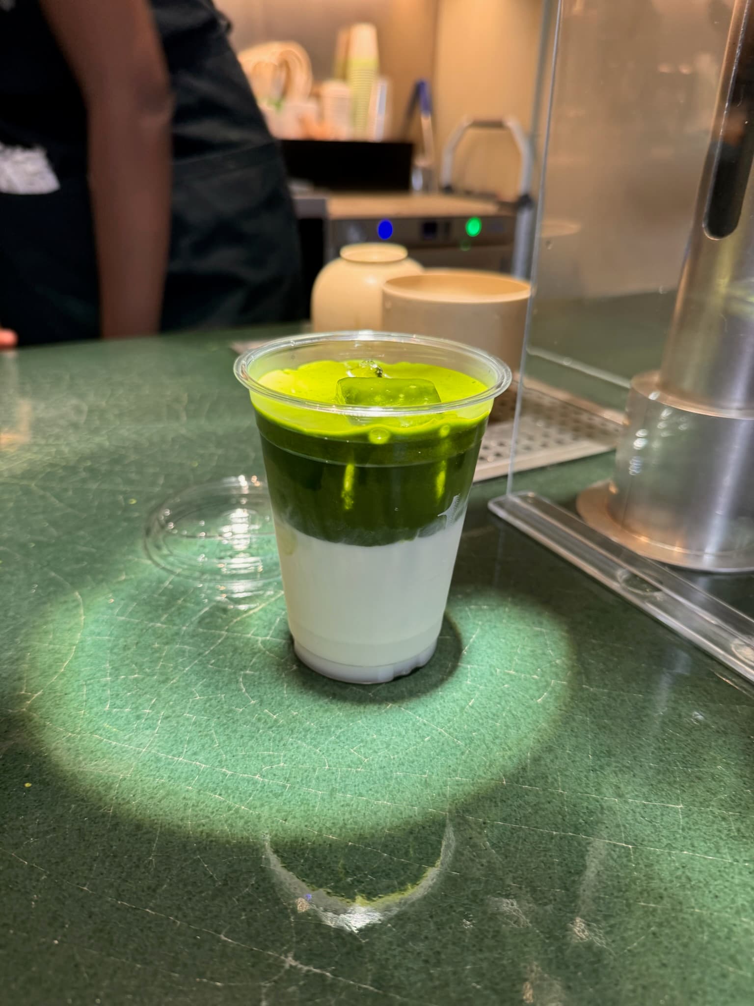 Iced matcha latte on a cafe counter
